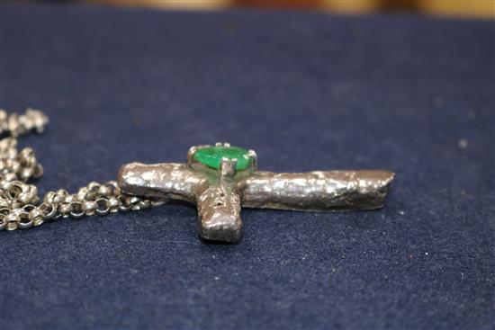 A 1970s white metal and emerald set cross pendant, on a silver belcher link chain, pendant 65mm.